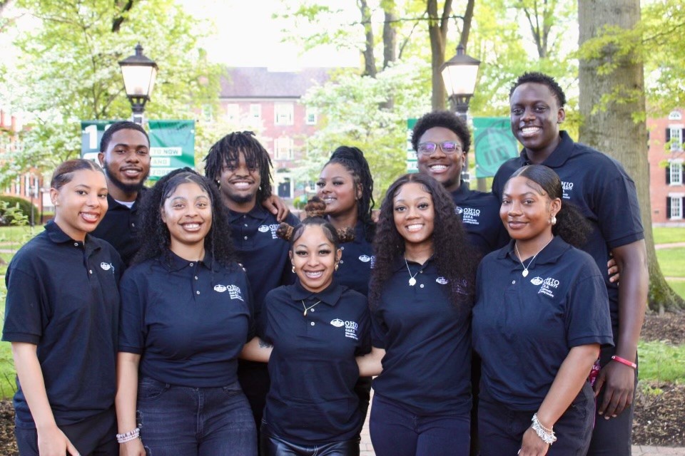 The 2024 OURS Executive Board photo including students smiling on College Green. 