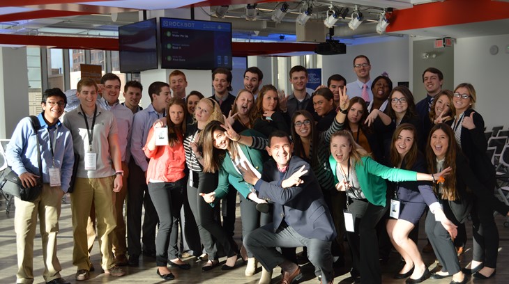 Students in they Schey Sales Centre pose at an airport