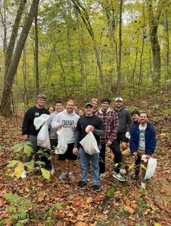 Members of Emerging Leaders picking up trash at Strouds Run