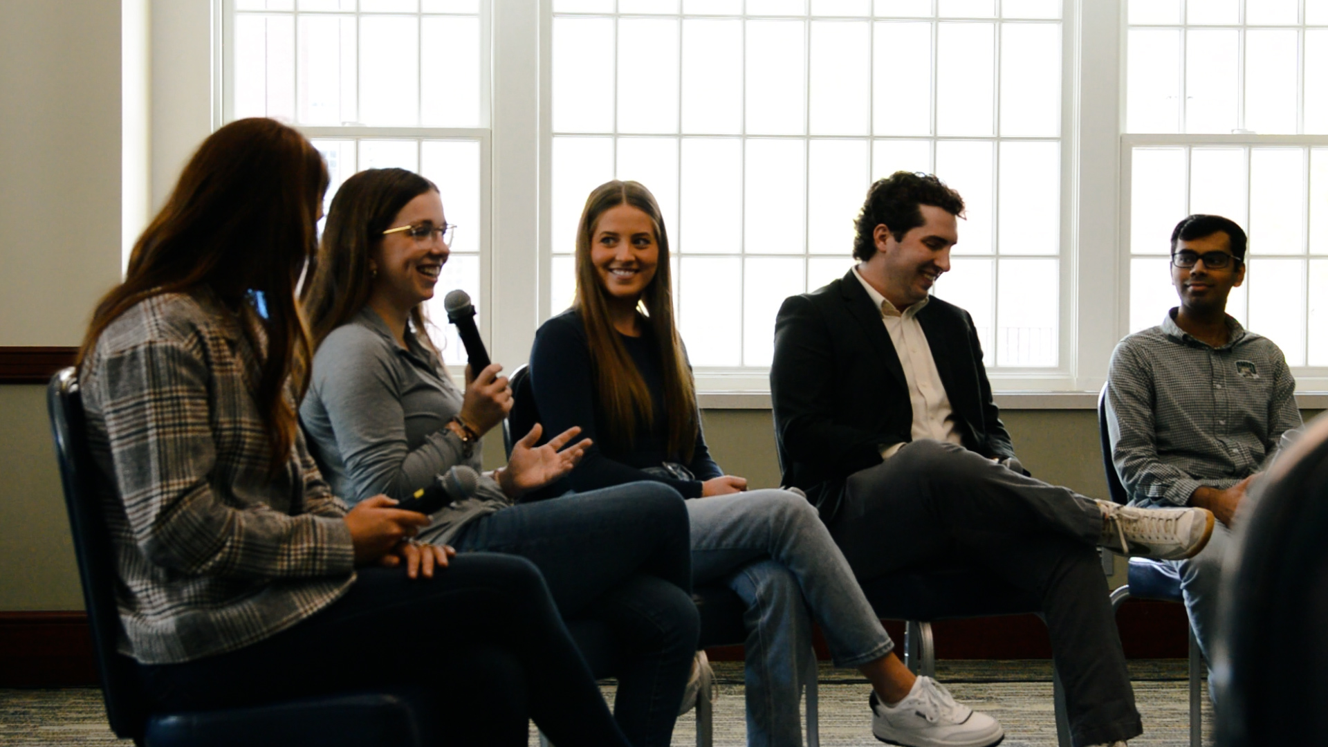 Alumni Panel sitting in chairs