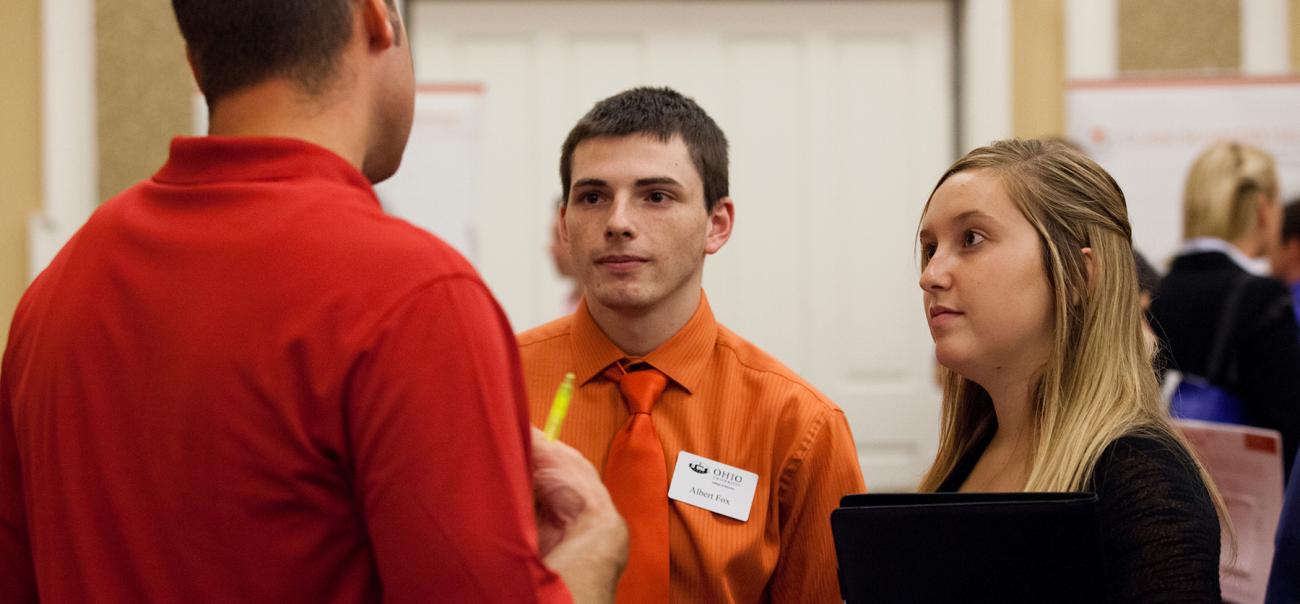 Students talk during a career fair