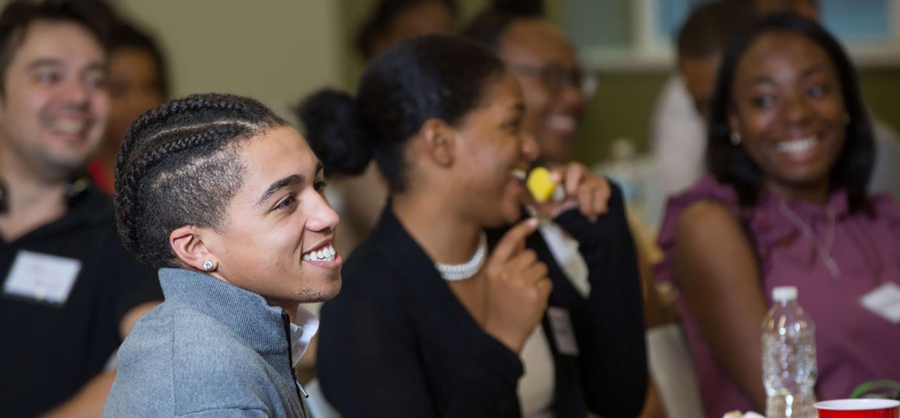 College of Business students smile during a presentation