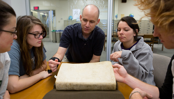 Bob Klein with students in archives looking at old math books