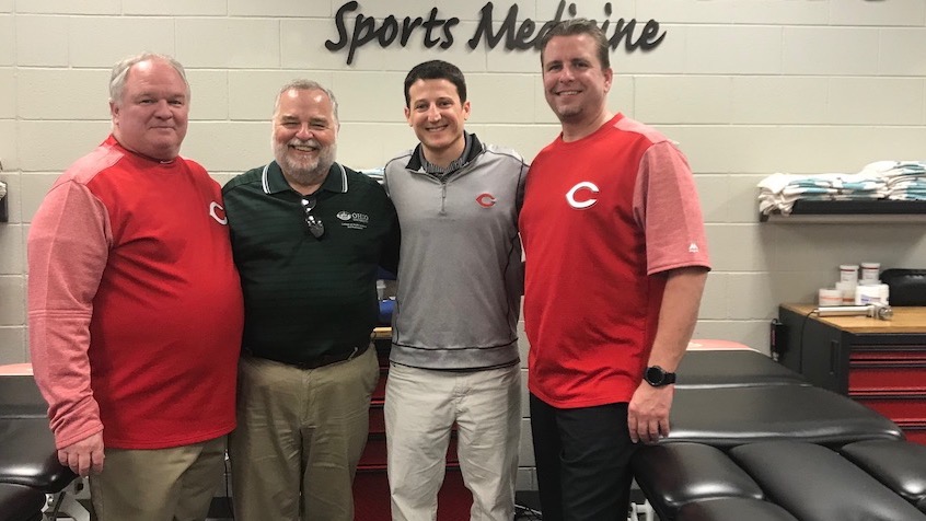 Pictured left to right — Charles Leddon, director of sports science initiatives for the Cincinnati Reds, Randy Leite, dean of Ohio University’s College of Health Sciences and Professions, Sam Grossman, assistant general manager for the Reds, and Patrick Serbus, director of athletic training for the Reds. The group posed for a photograph after signing the groundbreaking agreement between CHSP and the Reds.