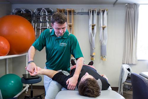 Physical therapist working with a patient