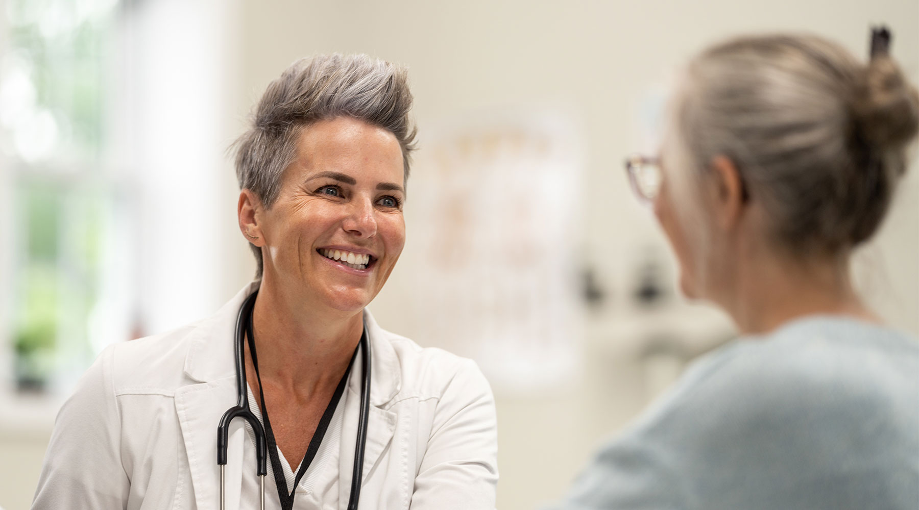 Doctor smiling at patient 