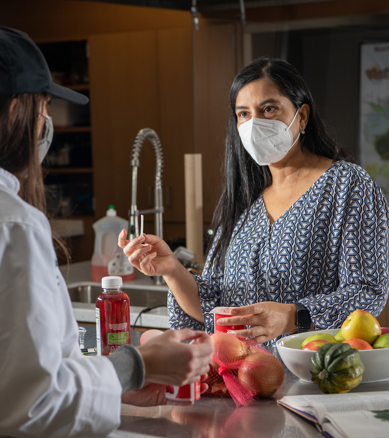 Nutrition instructor demonstrates a culinary process