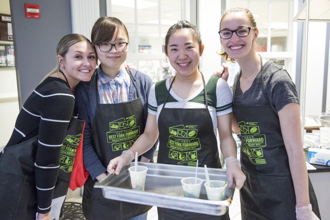 Ohio University students do a food demonstration in the Atrium.