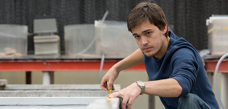 Mechanical Engineer student taking measurements.