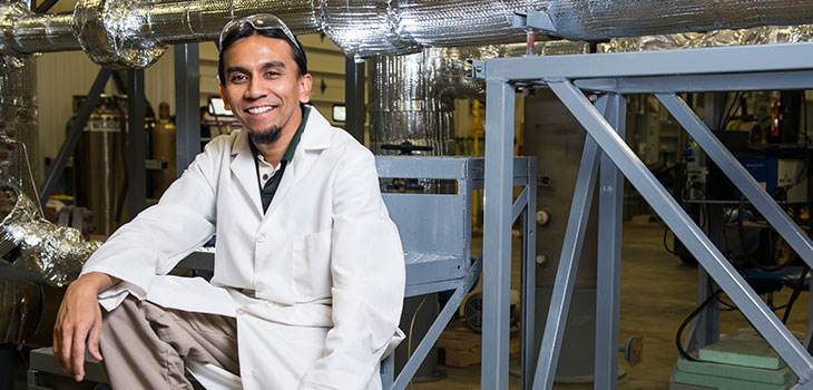 Man standing in front of machinery