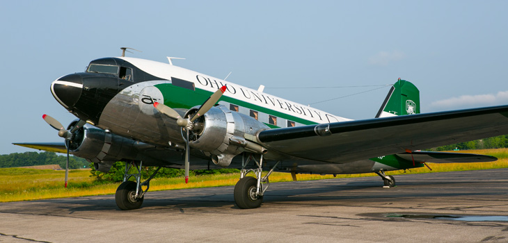 DC-3 painted green and white with 