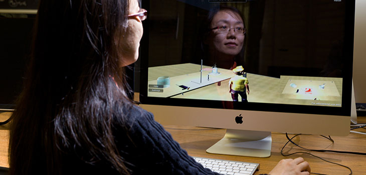 Woman working at an iMac