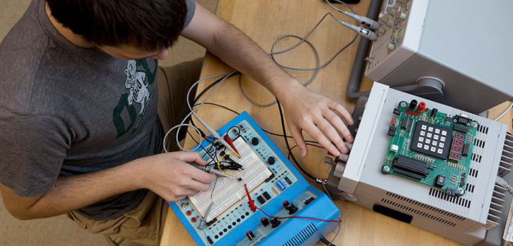 Student works with electrical engineering equipment