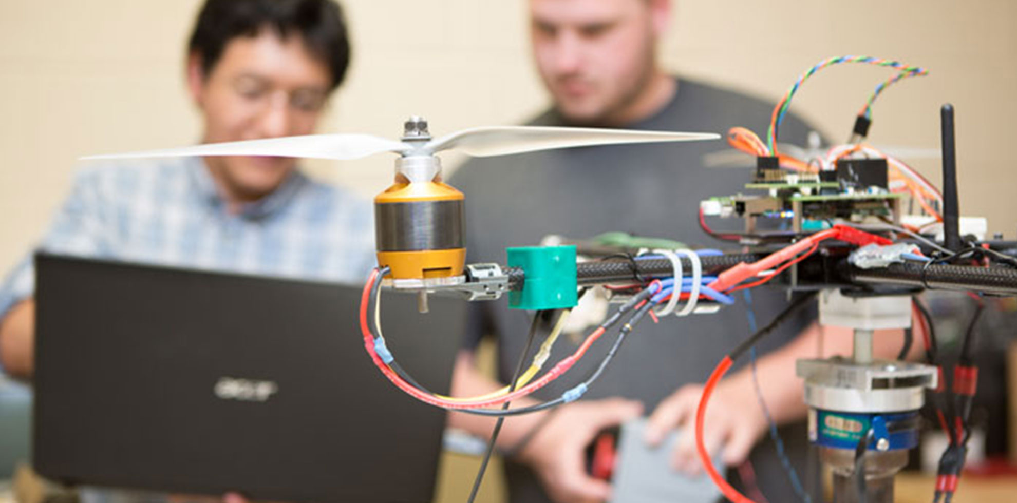 Students working on a drone