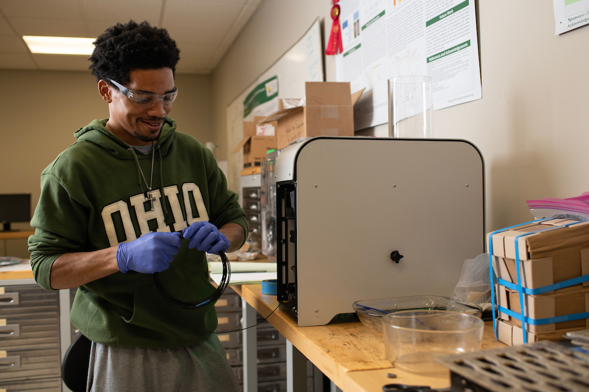 student working with electronics