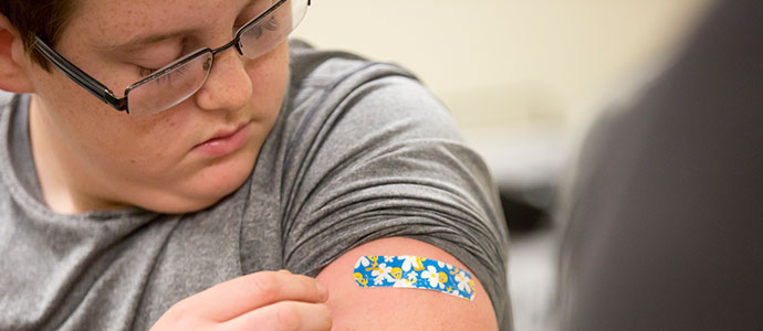 Child with bandaid on arm