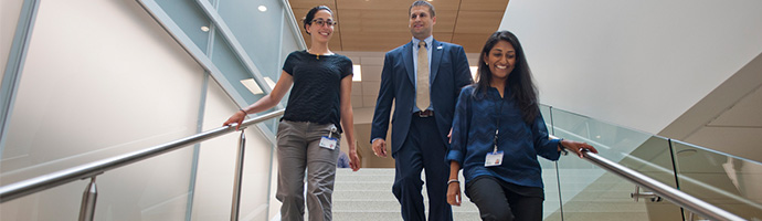 Staff walking down stairs