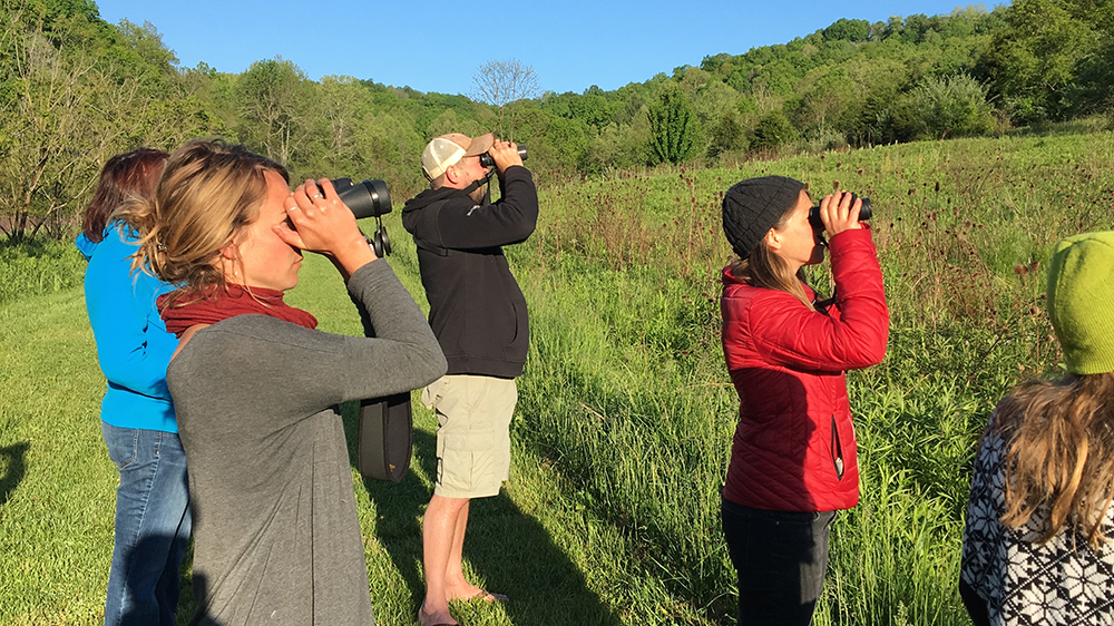 People looking through binoculars