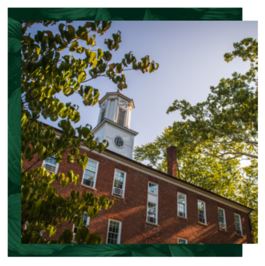 Cutler Hall with leaf design behind.