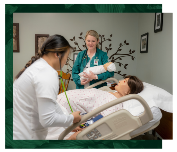 Two nursing students training with patient model.