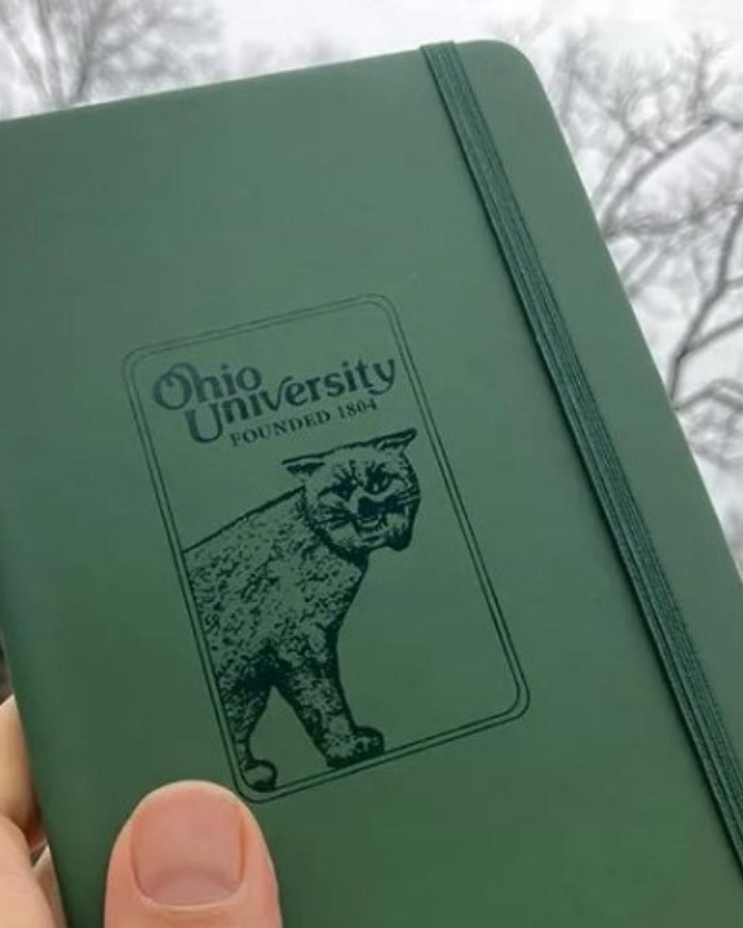Green journal with vintage Bobcat and Ohio University designs.