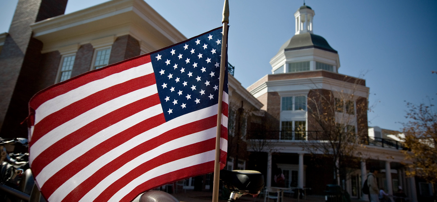 An American flag waves in the wind outside Baker University Center