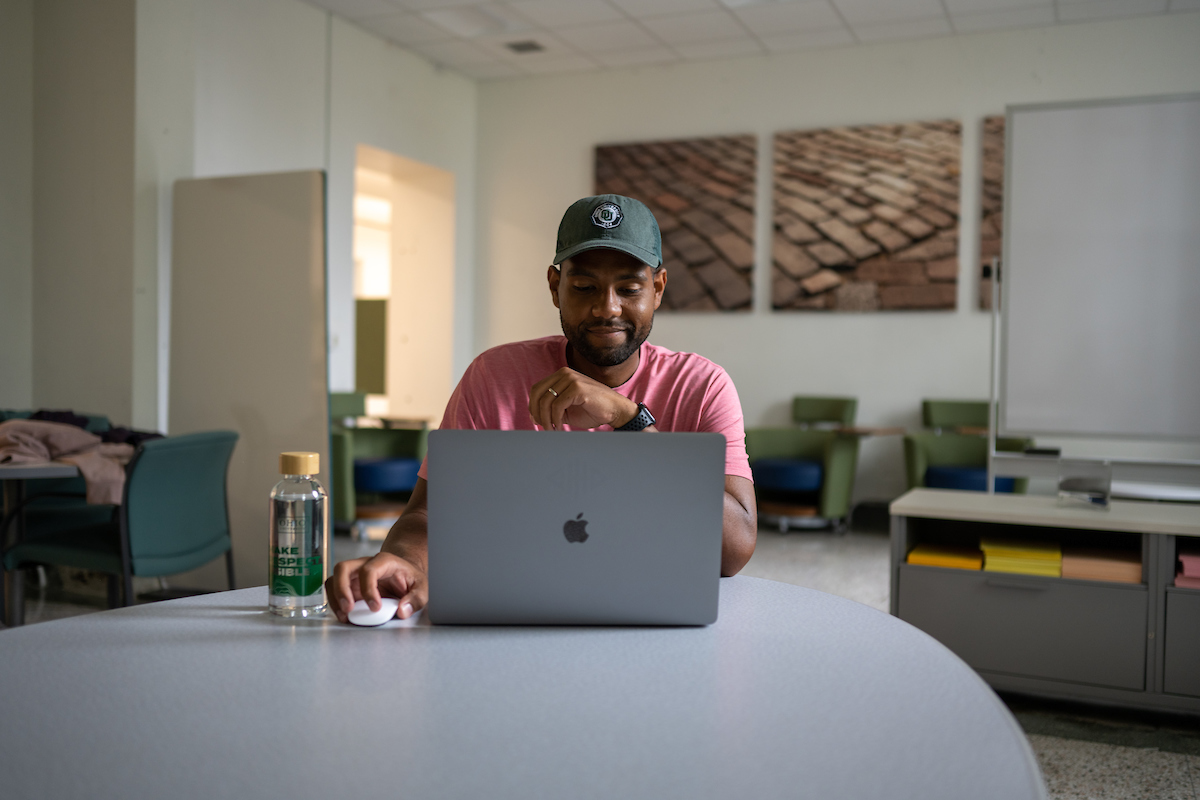 A person looking at their laptop