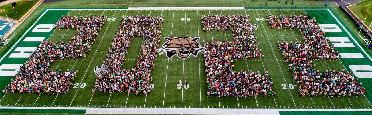 Students standing in the shape of 2022 at Peden Stadium