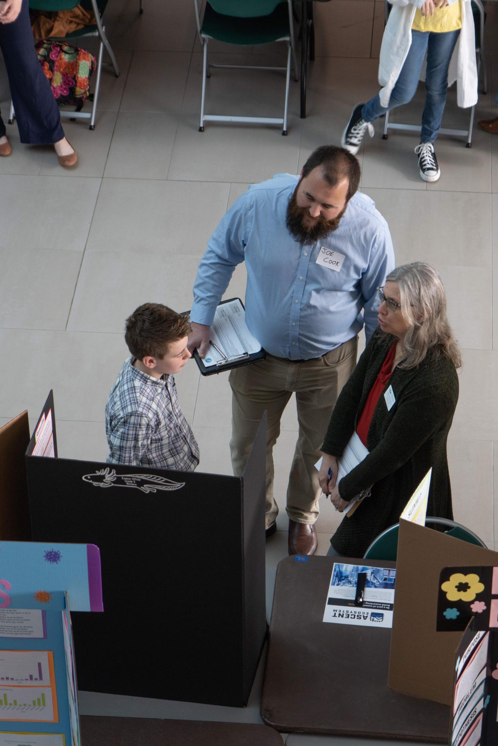 Judge viewing student's science display