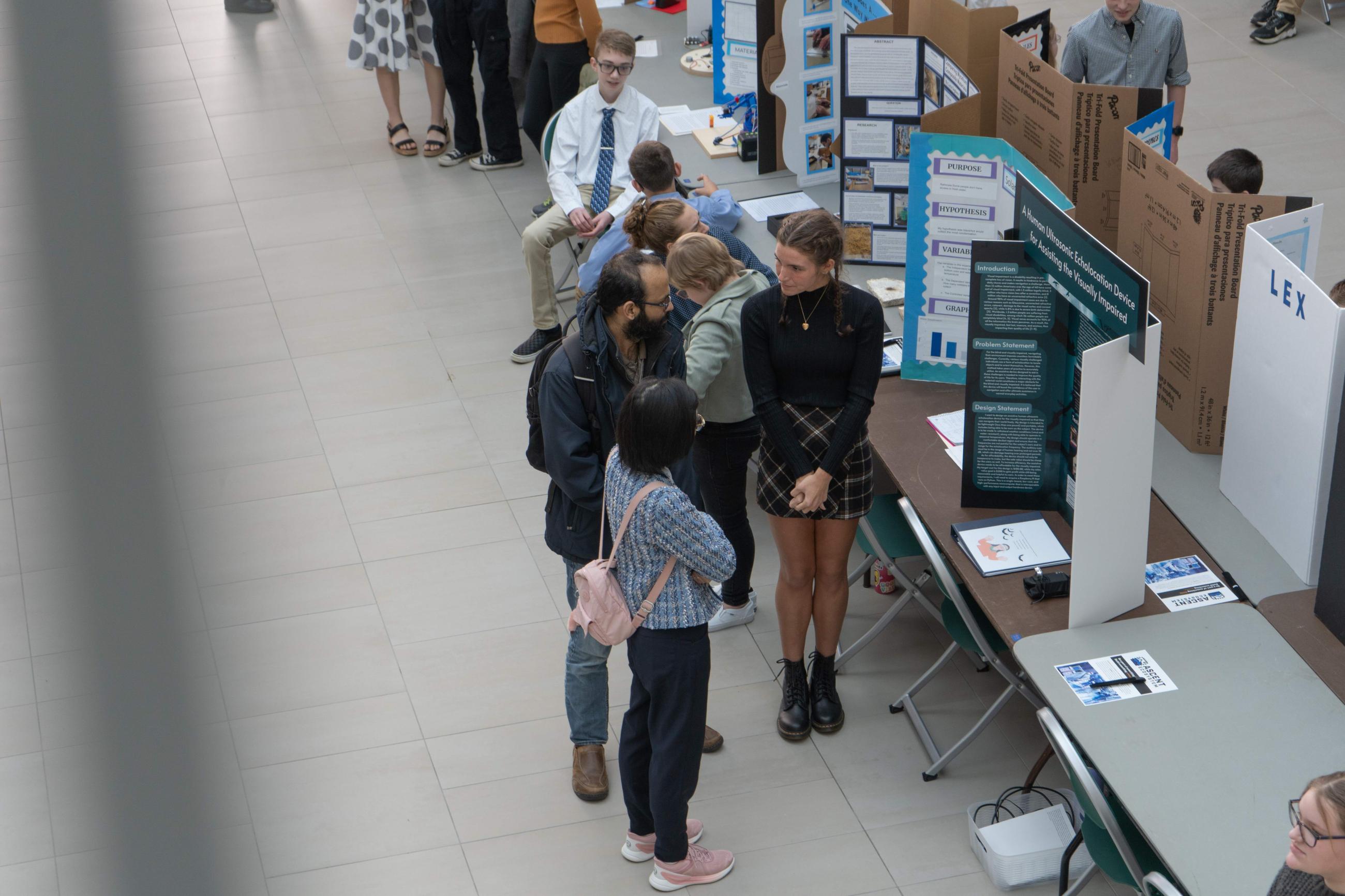 Judge viewing student's science display